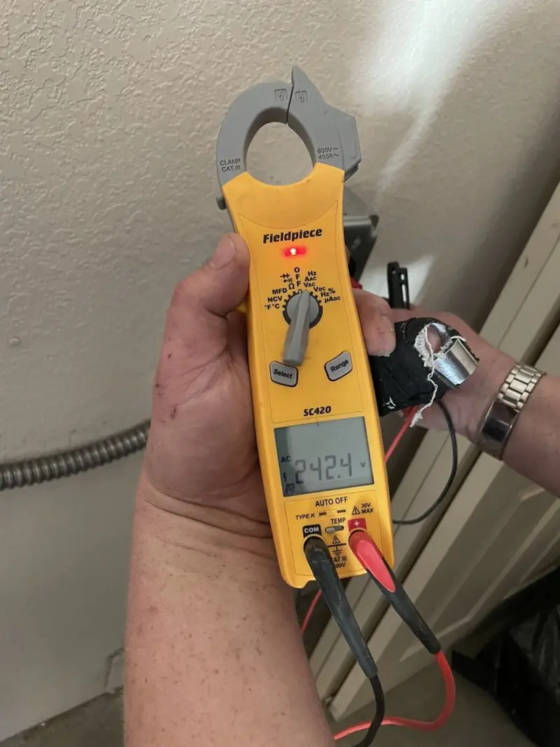 Voltage testing with clamp meter during Hot Tub / Pool Electrical Wiring in Zimmerman